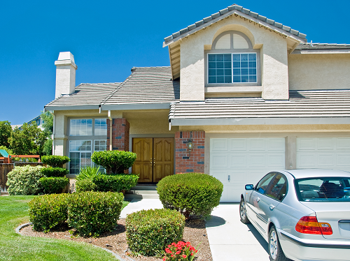 Home with a car in the driveway.